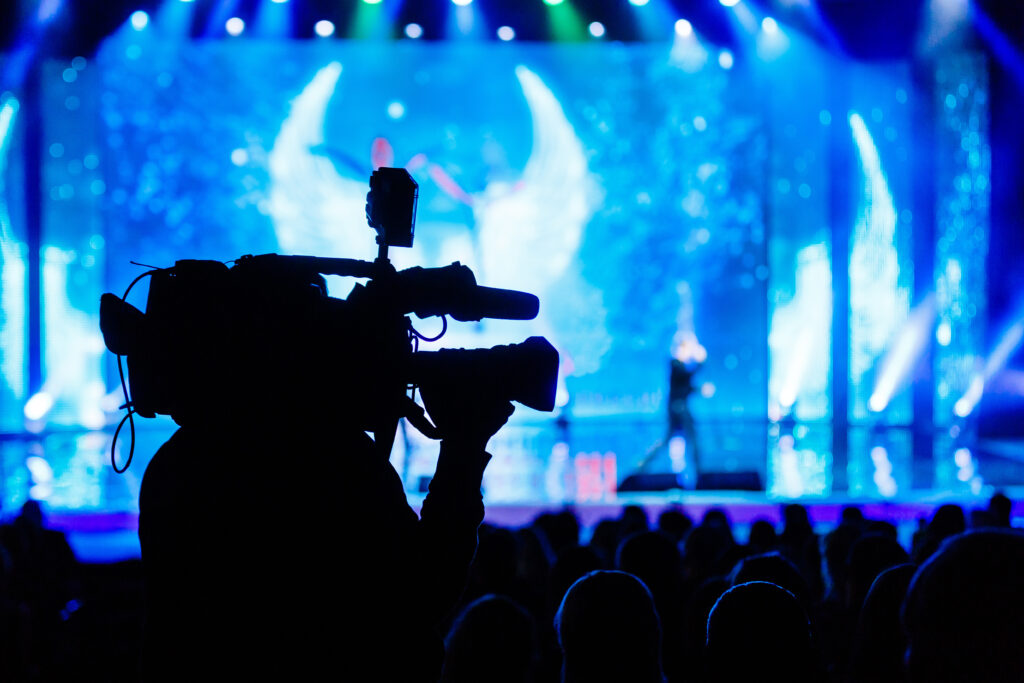 Camera operator capturing keynote speaker